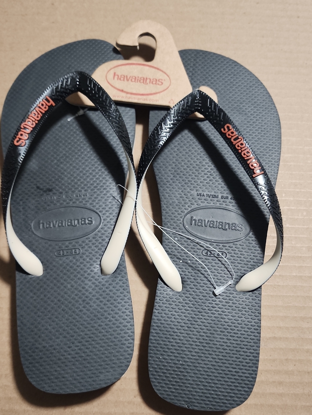 Havaianas Flip Flops - Charcoal Gray Footbed with Cream Straps and Orange Logo